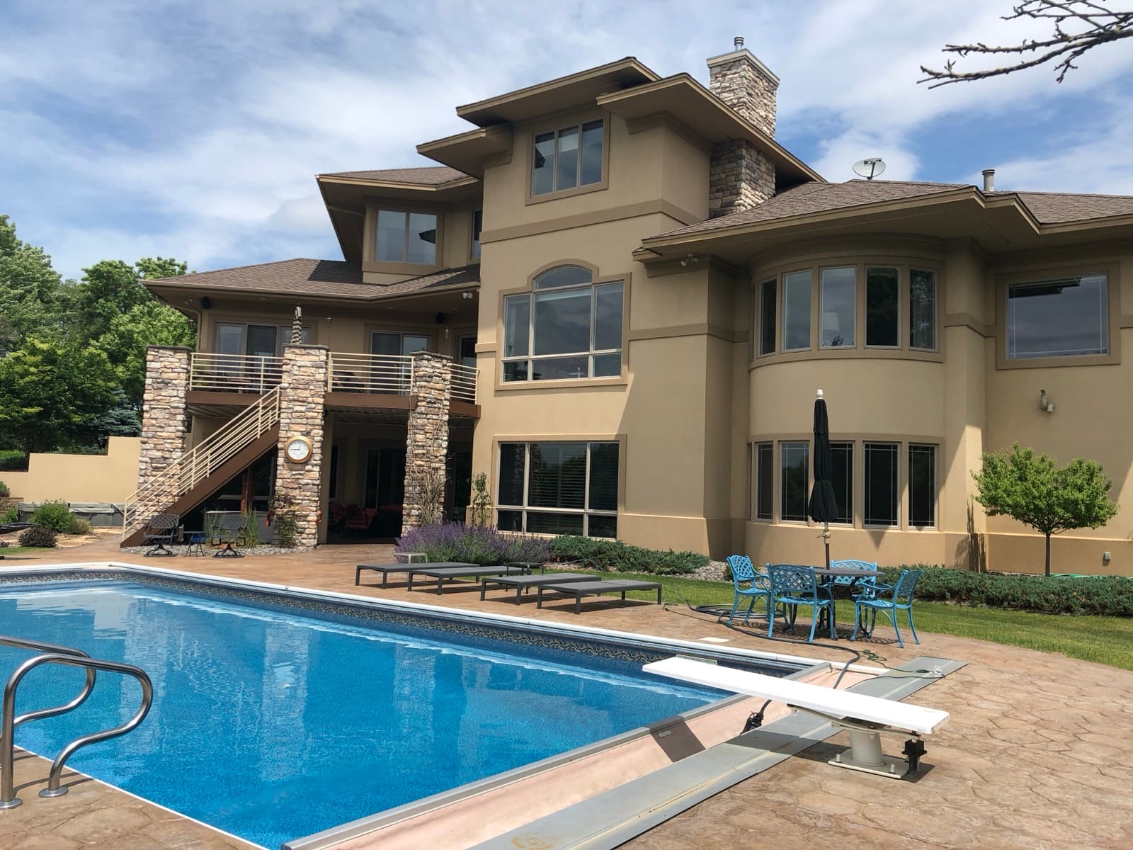 Luxury home with pool and stone facade